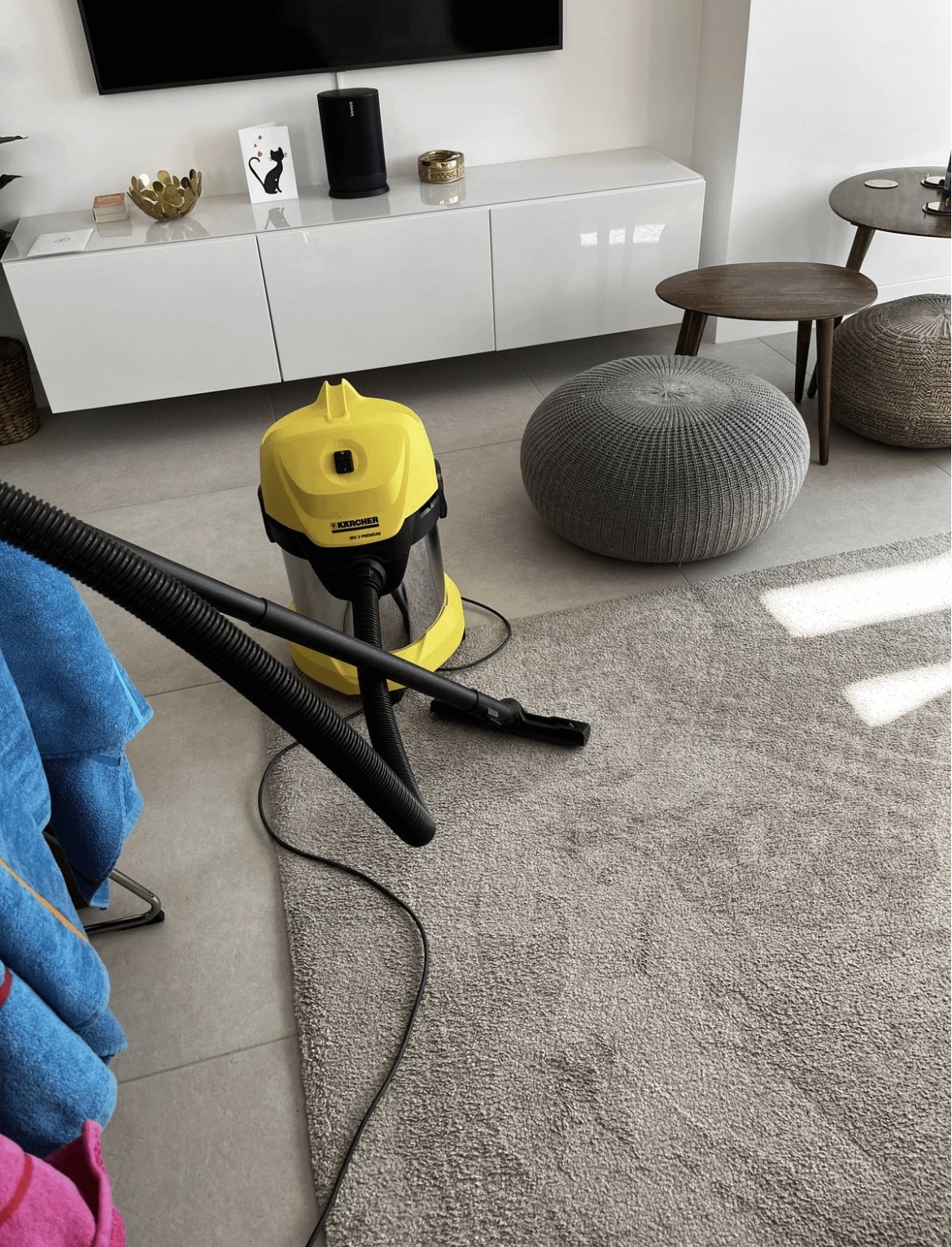 Professional equipment cleaning a living room carpet